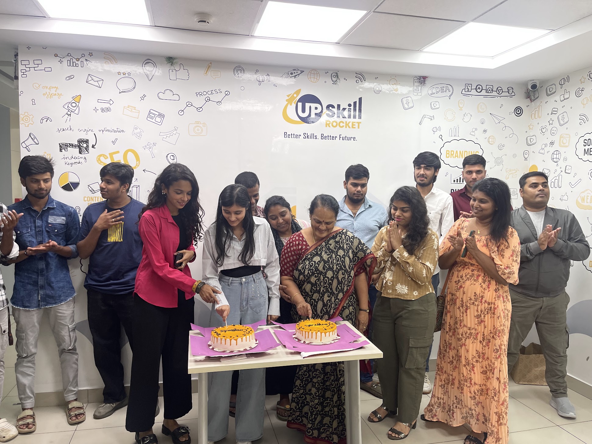 Upskill Rocket batch celebrating course completion with cakes